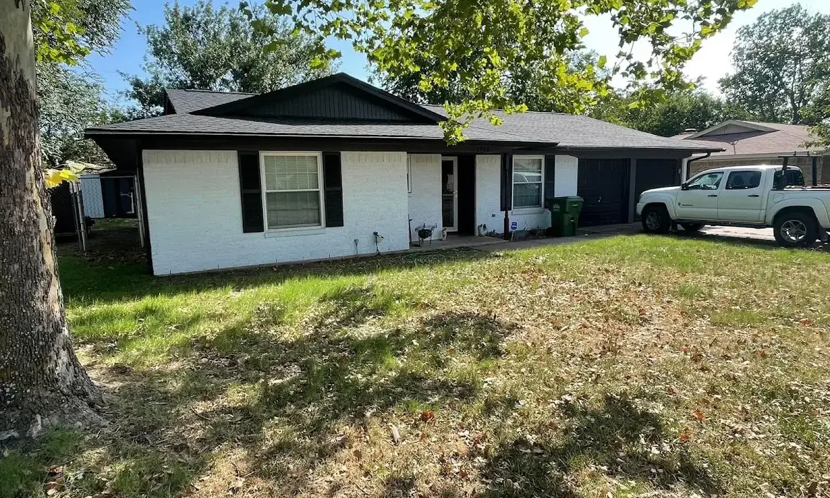Professional roofing crew working on a residential roof in Hooksett